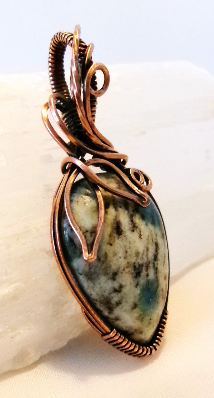 K-2 stone copper wire wrapped crystal pendant with leaf and spiral detail