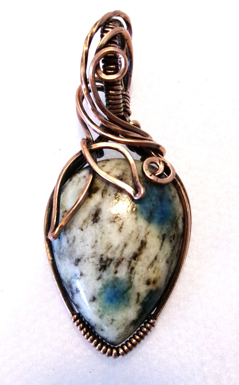 K-2 stone copper wire wrapped crystal pendant with leaf and spiral detail
