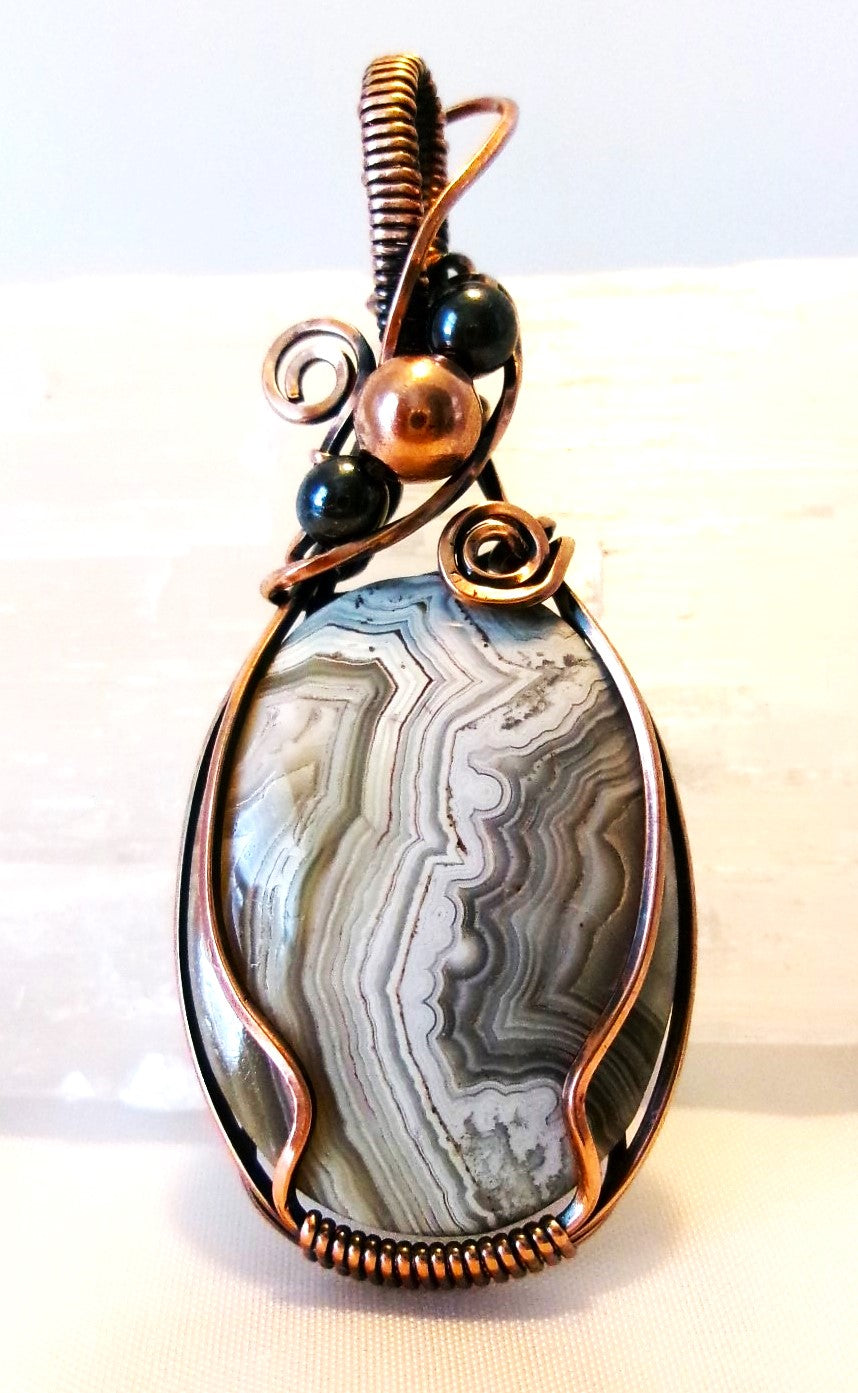 Crazy Lace Agate gemstone copper wire wrapped crystal pendant with hematite and copper accent beads