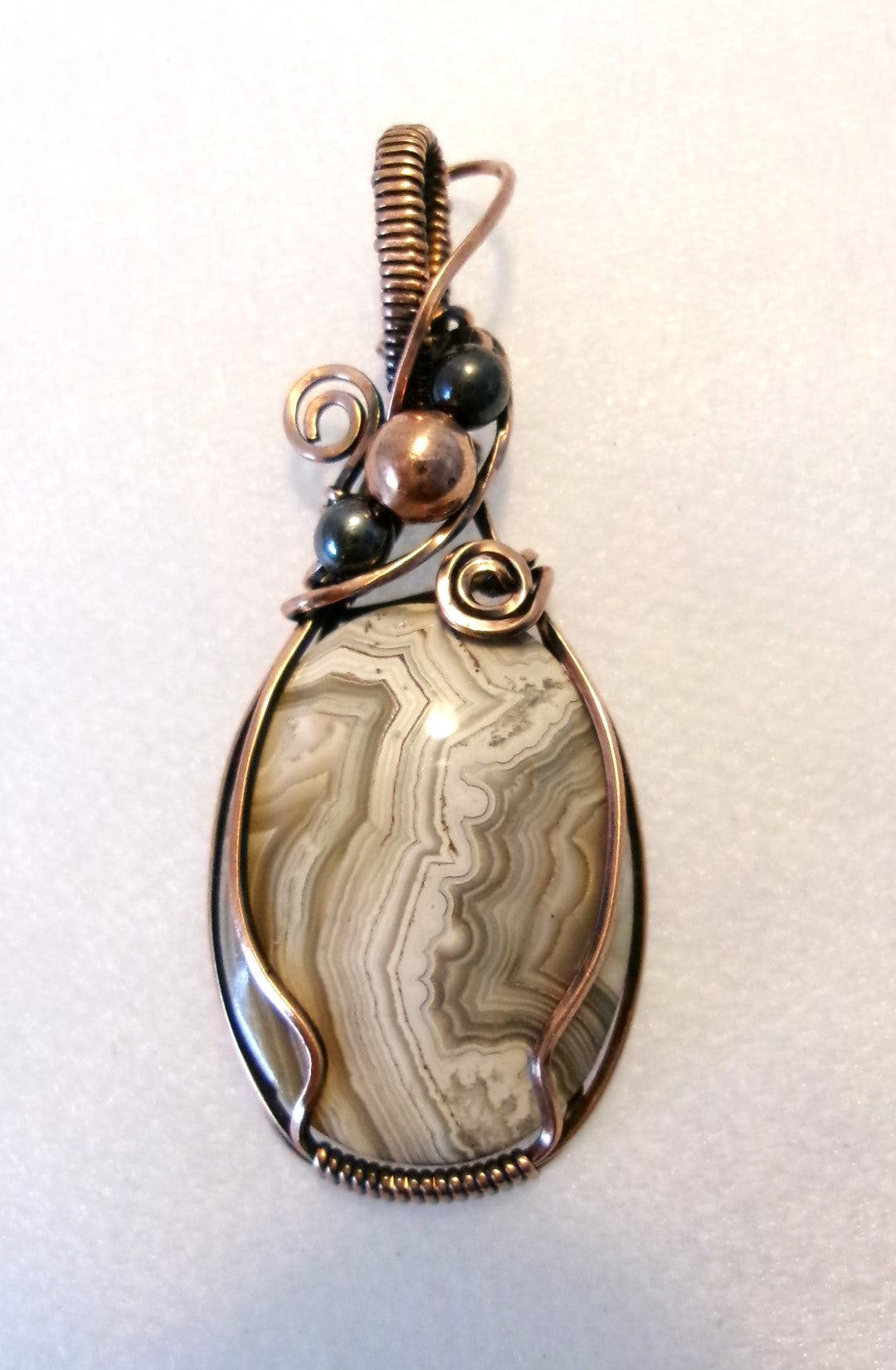 Crazy Lace Agate gemstone copper wire wrapped crystal pendant with hematite and copper accent beads