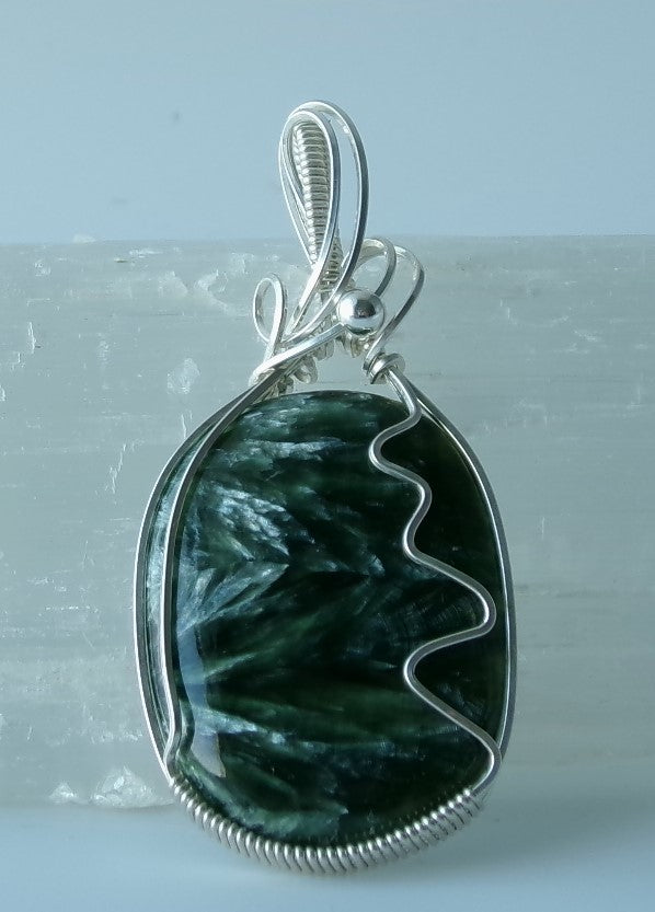 Seraphinite gemstone sterling silver wire wrapped crystal pendant with a sterling silver accent bead