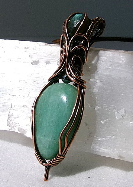 Amazonite gemstone copper wire wrapped crystal pendant with a blue-green faceted labradorite gemstone set in a woven bail and a hematite accent bead