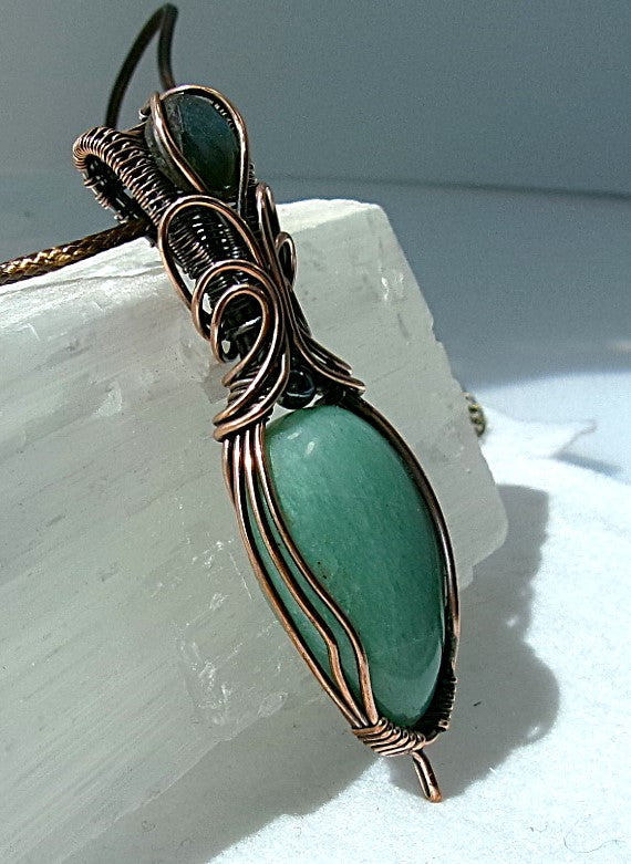 Amazonite gemstone copper wire wrapped crystal pendant with a blue-green faceted labradorite gemstone set in a woven bail and a hematite accent bead