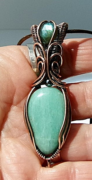 Amazonite gemstone copper wire wrapped crystal pendant with a blue-green faceted labradorite gemstone set in a woven bail and a hematite accent bead