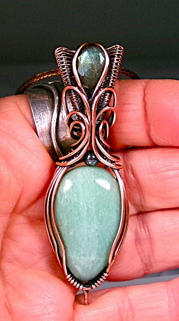 Amazonite gemstone copper wire wrapped crystal pendant with a blue-green faceted labradorite gemstone set in a woven bail and a hematite accent bead