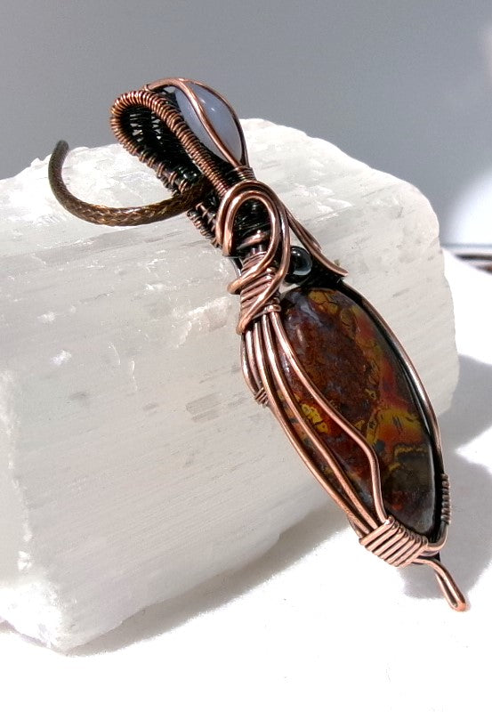 Agatized Jasper gemstone copper wire wrapped crystal pendant with blue chalcedony gemstone set in a woven bail and hematite accent bead