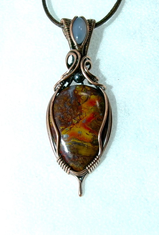 Agatized Jasper gemstone copper wire wrapped crystal pendant with blue chalcedony gemstone set in a woven bail and hematite accent bead