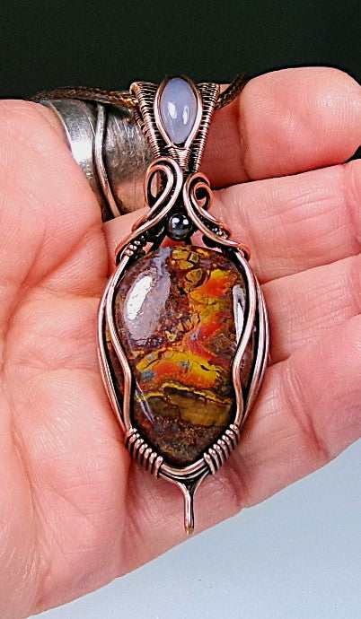 Agatized Jasper gemstone copper wire wrapped crystal pendant with blue chalcedony gemstone set in a woven bail and hematite accent bead
