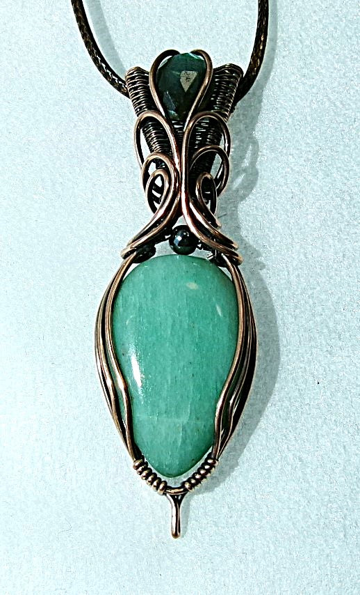 Amazonite gemstone copper wire wrapped crystal pendant with a blue-green faceted labradorite gemstone set in a woven bail and a hematite accent bead