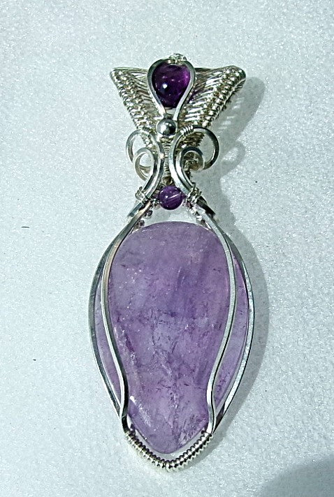 Amethyst gemstone sterling silver wire wrapped crystal pendant with amethyst gemstone set in a woven bail with amethyst and sterling silver accent beads
