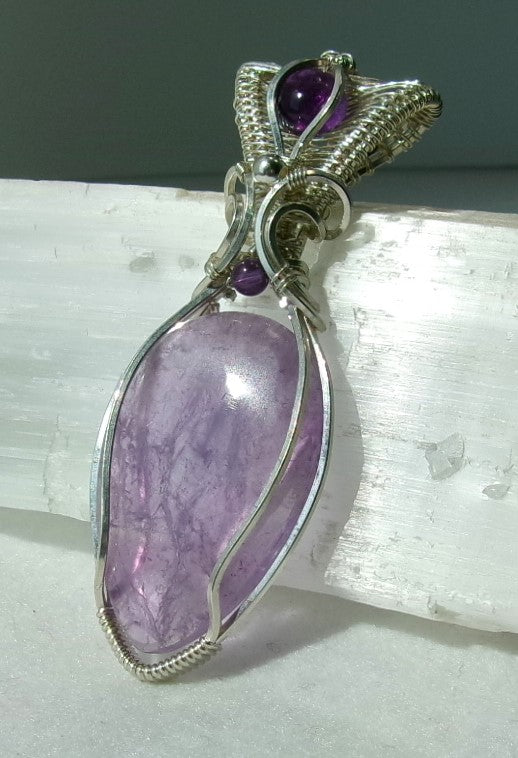 Amethyst gemstone sterling silver wire wrapped crystal pendant with amethyst gemstone set in a woven bail with amethyst and sterling silver accent beads