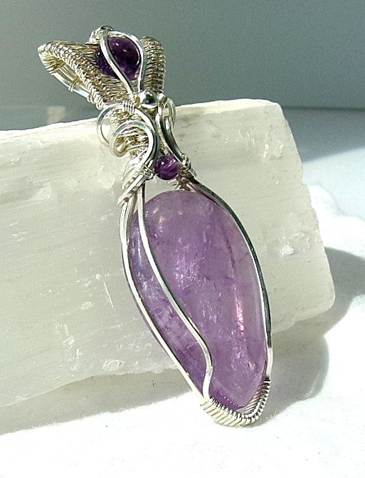 Amethyst gemstone sterling silver wire wrapped crystal pendant with amethyst gemstone set in a woven bail with amethyst and sterling silver accent beads
