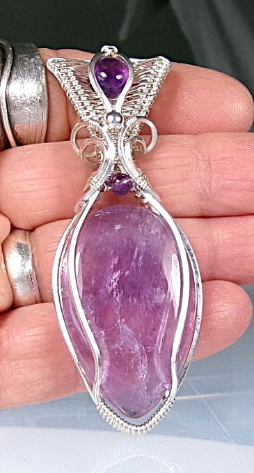 Amethyst gemstone sterling silver wire wrapped crystal pendant with amethyst gemstone set in a woven bail with amethyst and sterling silver accent beads