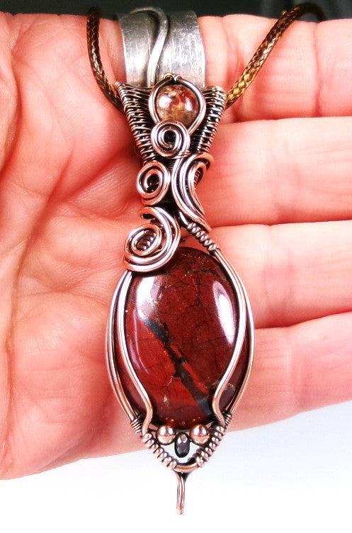 Red Jasper gemstone copper wire wrapped crystal pendant with leopard skin jasper gemstone set in a woven bail with copper and hematite accent beads