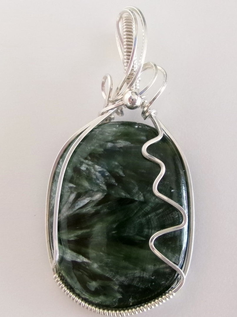 Seraphinite gemstone sterling silver wire wrapped crystal pendant with a sterling silver accent bead