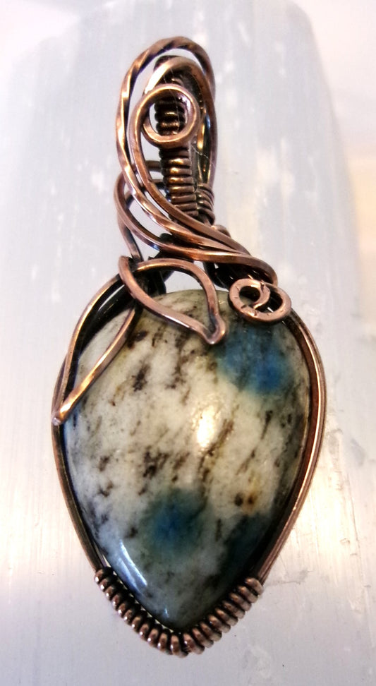 K-2 stone copper wire wrapped crystal pendant with leaf and spiral detail