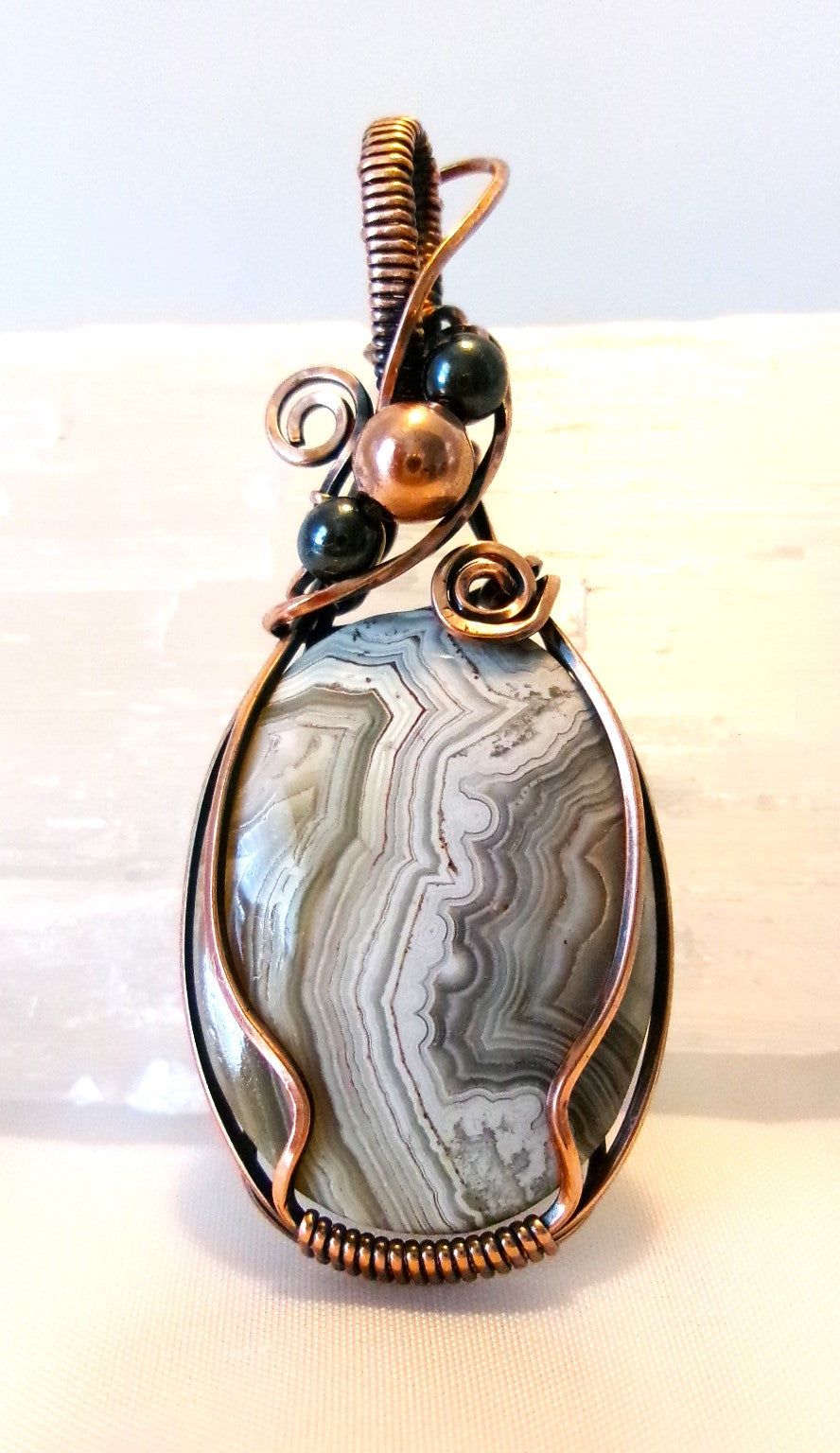 Crazy Lace Agate gemstone copper wire wrapped crystal pendant with hematite and copper accent beads