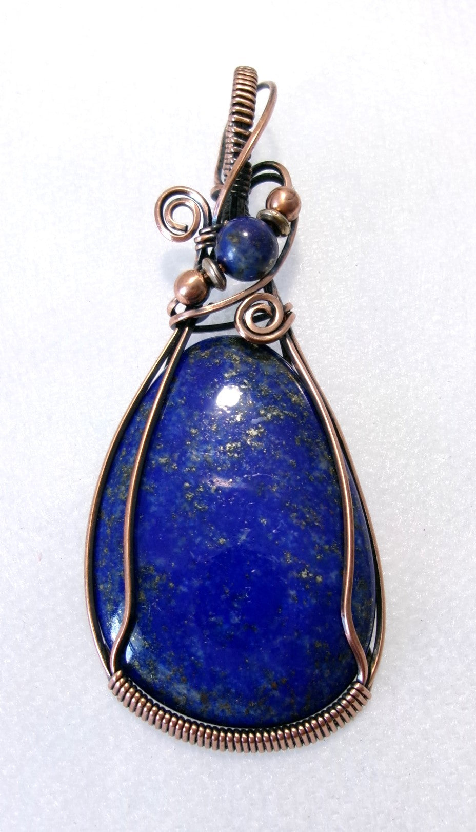 Lapis Lazuli gemstone copper wire wrapped crystal pendant with lapis lazuli, copper, and silver accent beads