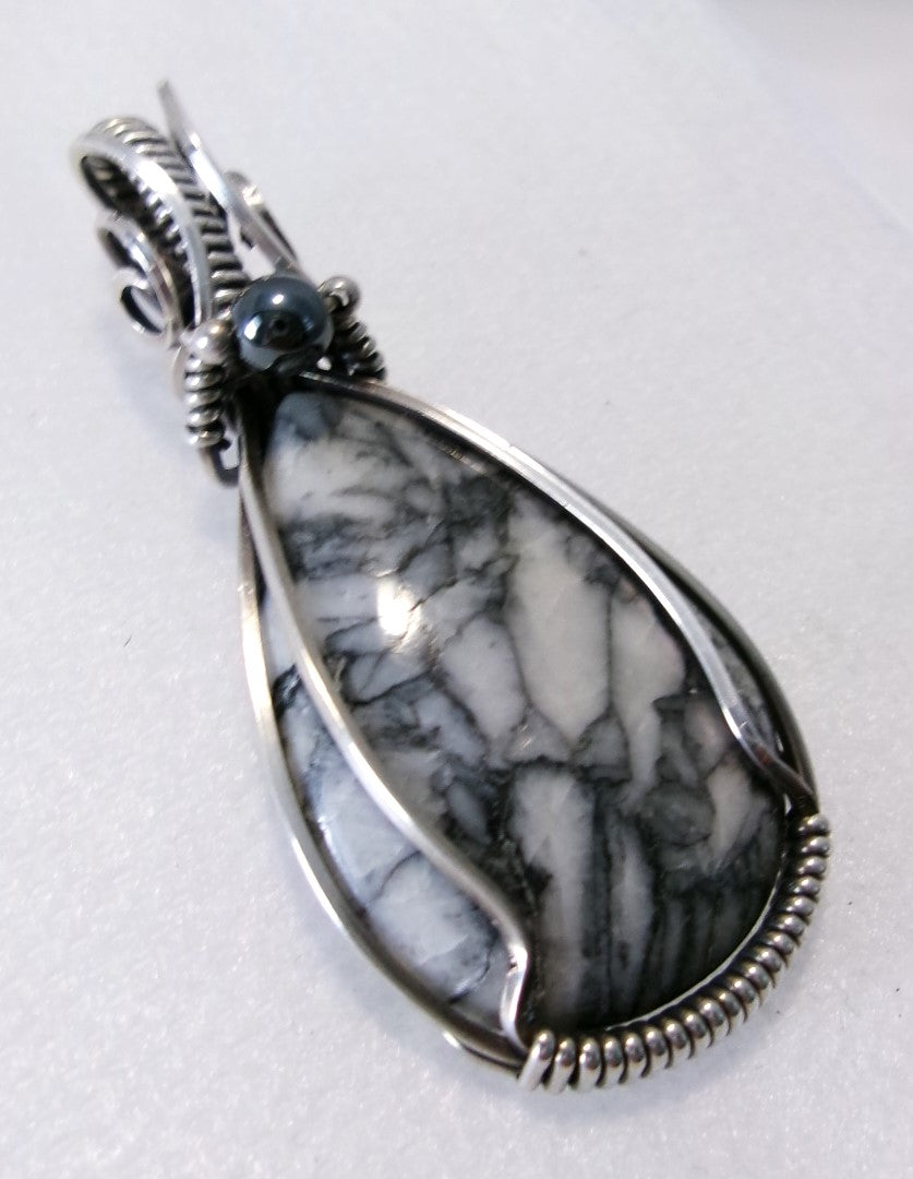Pinolith gemstone sterling silver wire wrapped crystal pendant with hematite and sterling silver accent beads