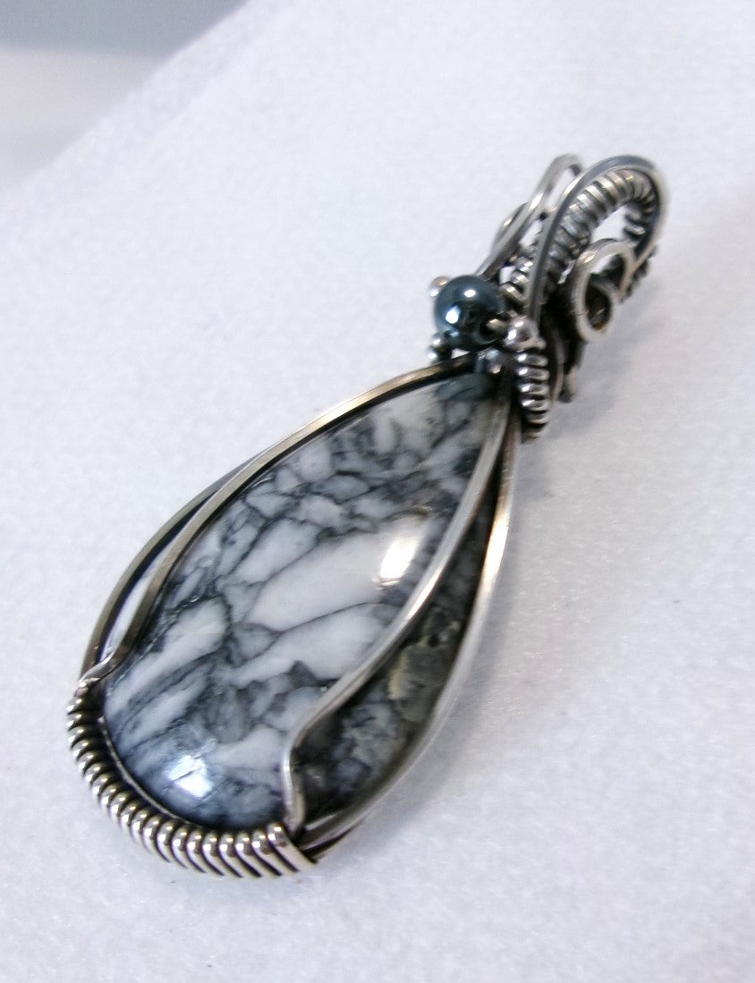 Pinolith gemstone sterling silver wire wrapped crystal pendant with hematite and sterling silver accent beads