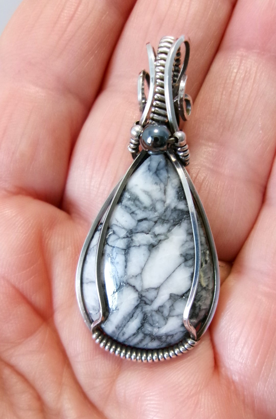 Pinolith gemstone sterling silver wire wrapped crystal pendant with hematite and sterling silver accent beads