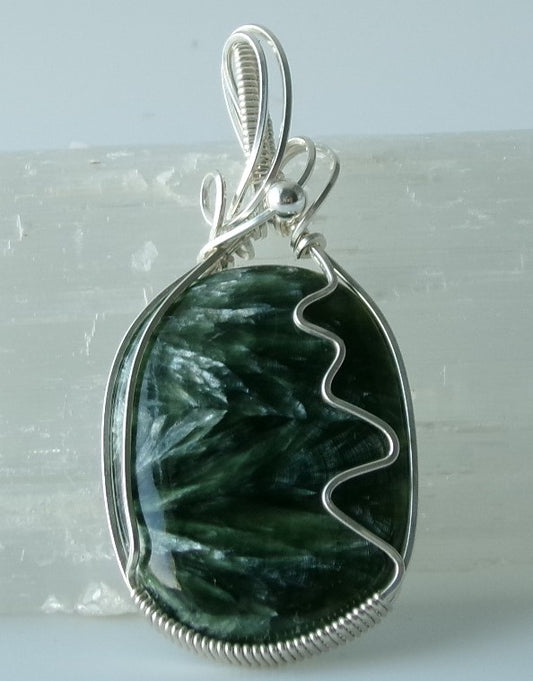 Seraphinite gemstone sterling silver wire wrapped crystal pendant with a sterling silver accent bead