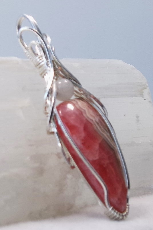 Rhodochrosite gemstone sterling silver wire wrapped crystal pendant with white quartz accent bead