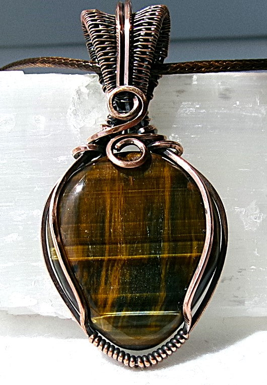 Blue Tiger’s Eye gemstone copper wire wrapped crystal pendant with a woven bail and swirls