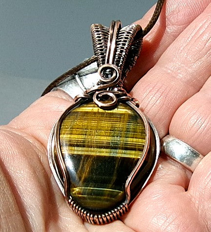 Blue Tiger’s Eye gemstone copper wire wrapped crystal pendant with a woven bail and swirls