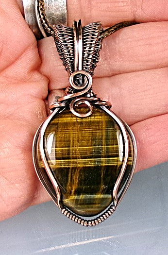 Blue Tiger’s Eye gemstone copper wire wrapped crystal pendant with a woven bail and swirls