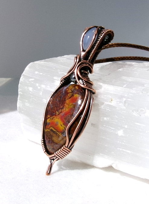 Agatized Jasper gemstone copper wire wrapped crystal pendant with blue chalcedony gemstone set in a woven bail and hematite accent bead