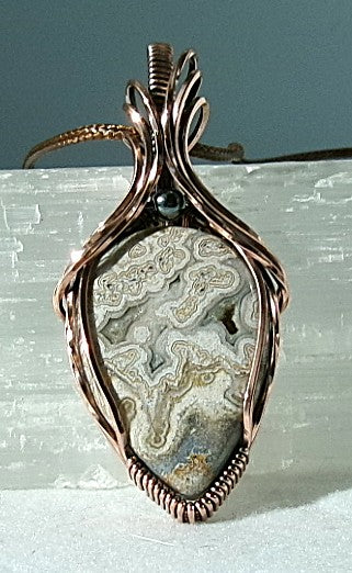 Crazy Lace Agate gemstone copper wire wrapped crystal pendant with a hematite accent bead