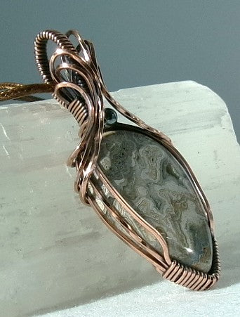 Crazy Lace Agate gemstone copper wire wrapped crystal pendant with a hematite accent bead