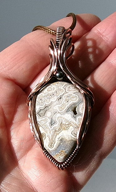 Crazy Lace Agate gemstone copper wire wrapped crystal pendant with a hematite accent bead