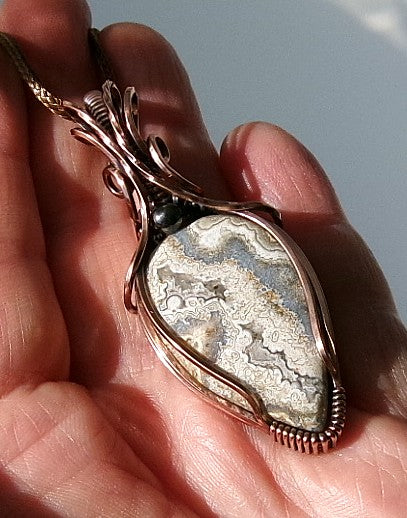 Crazy Lace Agate gemstone copper wire wrapped crystal pendant with a hematite accent bead