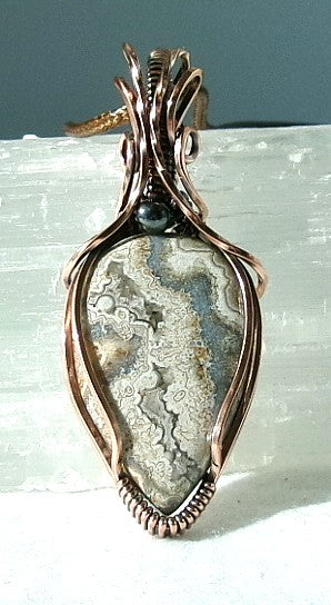 Crazy Lace Agate gemstone copper wire wrapped crystal pendant with a hematite accent bead
