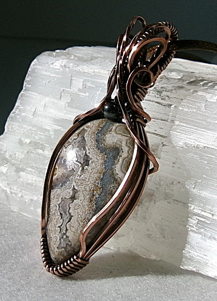 Crazy Lace Agate gemstone copper wire wrapped crystal pendant with a hematite accent bead