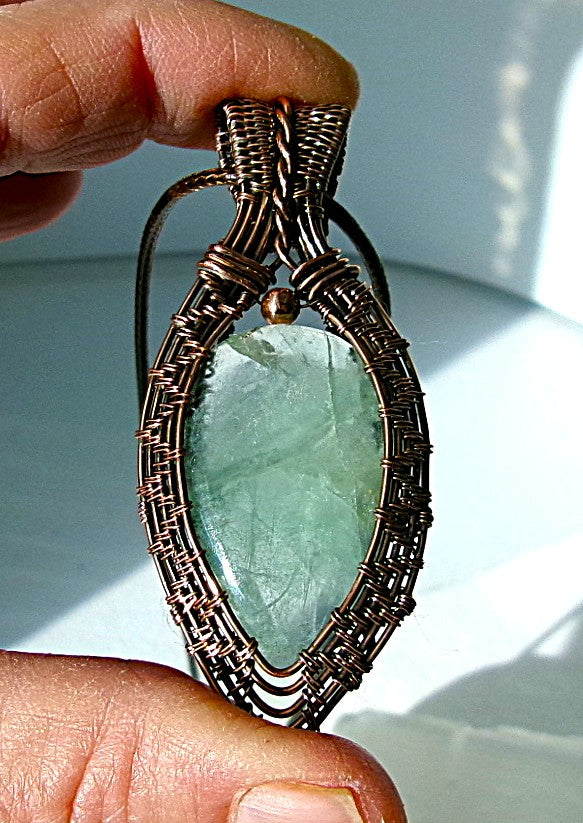 Green Fluorite gemstone copper wire wrapped crystal pendant with a copper accent bead