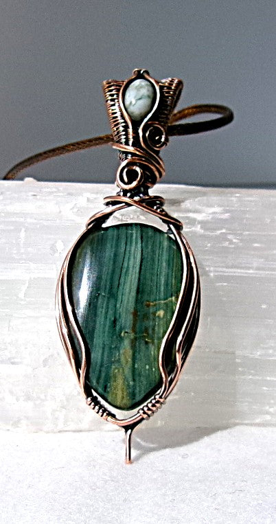 Gary Green Jasper gemstone copper wire wrapped crystal pendant with a woven bail that contains a tree agate gemstone