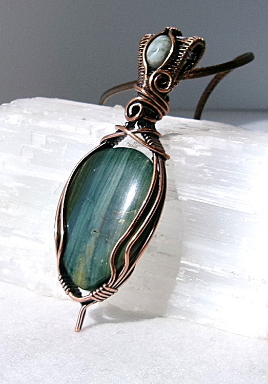 Gary Green Jasper gemstone copper wire wrapped crystal pendant with a woven bail that contains a tree agate gemstone