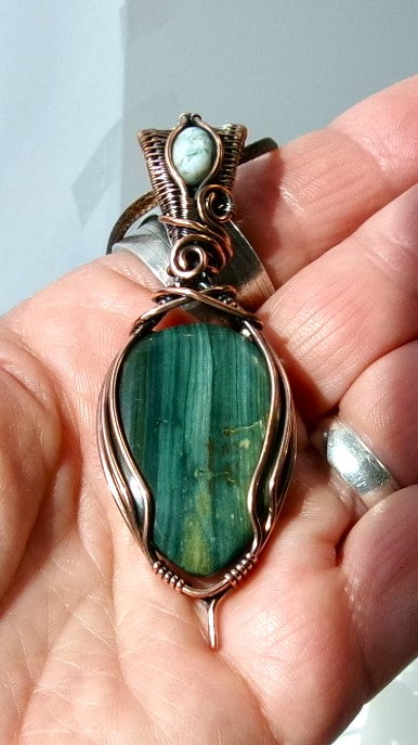 Gary Green Jasper gemstone copper wire wrapped crystal pendant with a woven bail that contains a tree agate gemstone