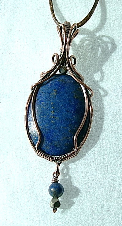 Lapis Lazuli gemstone copper wire wrapped crystal pendant with a beaded dangle features pyrite and lapis accent beads