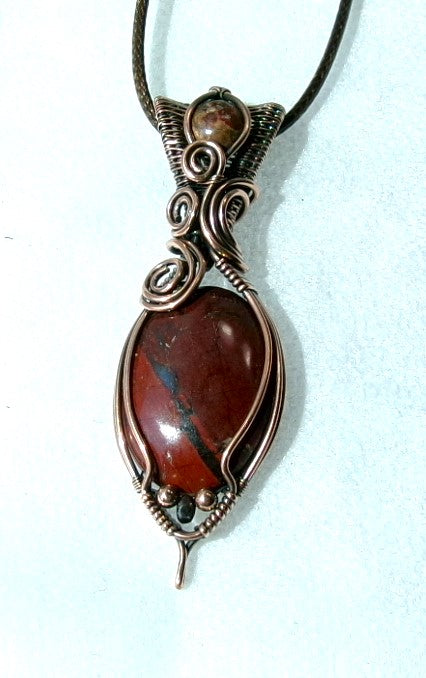 Red Jasper gemstone copper wire wrapped crystal pendant with leopard skin jasper gemstone set in a woven bail with copper and hematite accent beads