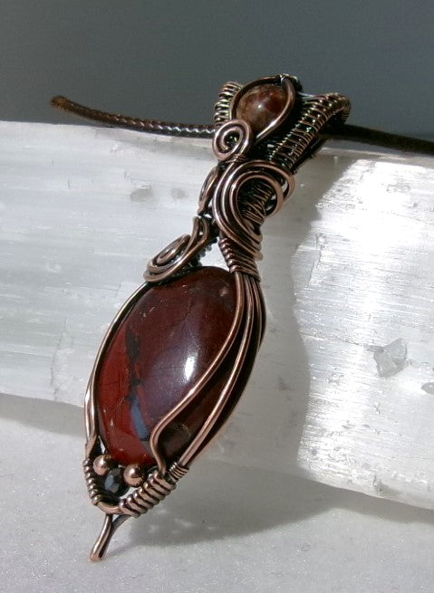 Red Jasper gemstone copper wire wrapped crystal pendant with leopard skin jasper gemstone set in a woven bail with copper and hematite accent beads