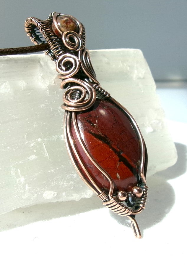 Red Jasper gemstone copper wire wrapped crystal pendant with leopard skin jasper gemstone set in a woven bail with copper and hematite accent beads