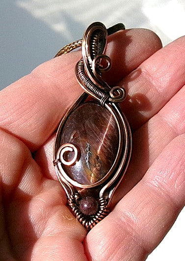 Red Tiger’s Eye gemstone copper wire wrapped crystal pendant with red garnet accent bead