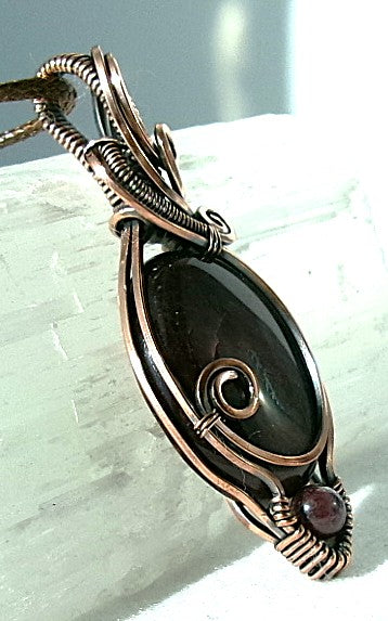 Red Tiger’s Eye gemstone copper wire wrapped crystal pendant with red garnet accent bead