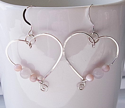 Rose quartz and pink shell sterling silver wire earrings in a heart shape design with a tiny spiral