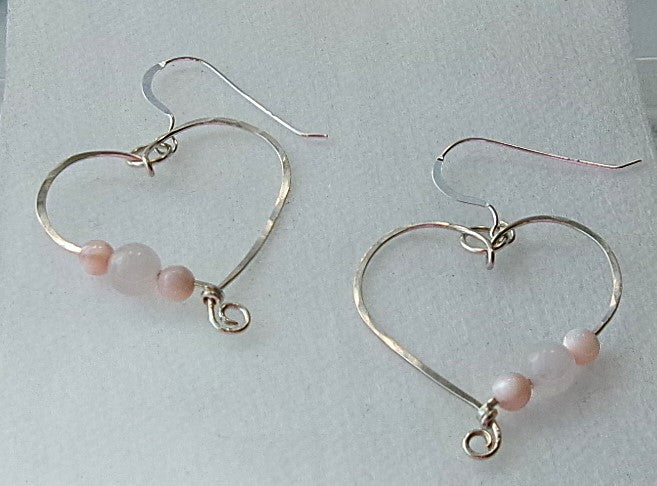 Rose quartz and pink shell sterling silver wire earrings in a heart shape design with a tiny spiral