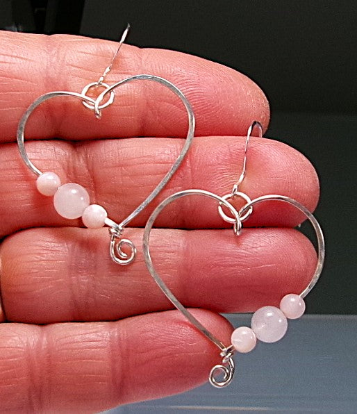 Rose quartz and pink shell sterling silver wire earrings in a heart shape design with a tiny spiral